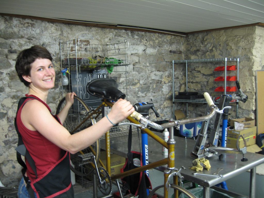 Car Martin standing in front of a bike stand, smiling.